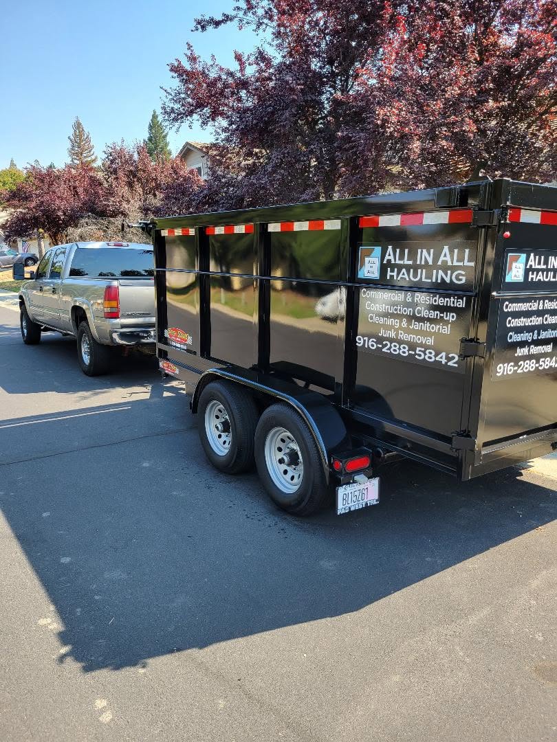 All in All Hauling dump trailer marked with commercial and residential services parked in a Rocklin neighborhood